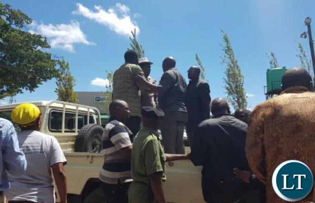 HH (in a hat) being transported to Liliayi