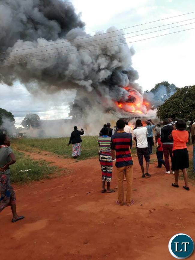 People watch as Chalimbana University burns