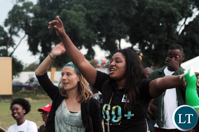 Some revelers at the Earth Hour concert enjoying the music