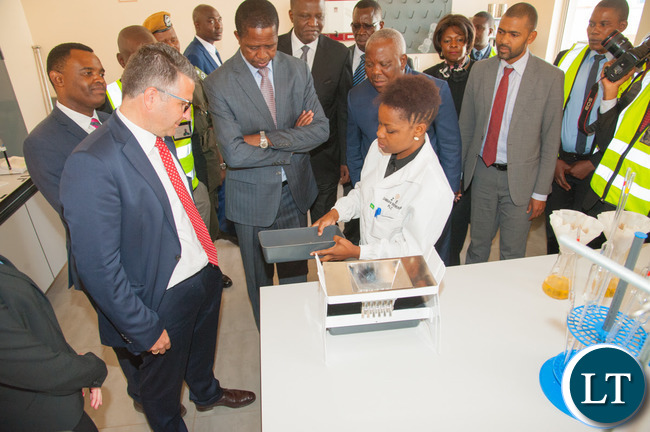 President Edgar Chagwa Lungu inspects barley in the laboratory at Zambian Breweries' new US$33 million malting plant.