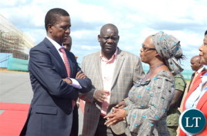 President Edgar Lungu (L) with PF deputy Secretary General Mumbi Phiri as Party Secretary General Davies Mwila (C) looks on at Kenneth Kaunda International Airport shortly before departure for Livingstone on Thursday, April 20,2017-Picture by THOMAS NSAMA