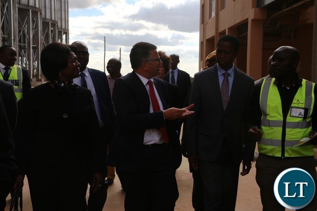 President Edgar Lungu confers with Zambia breweries Technical and Supply Chain Director Franz Schepping while Commerce Minister Magaret Mwanakatwe listerns during the tour and commissioning of the malting plant in Lusaka South Multi-facility Zone