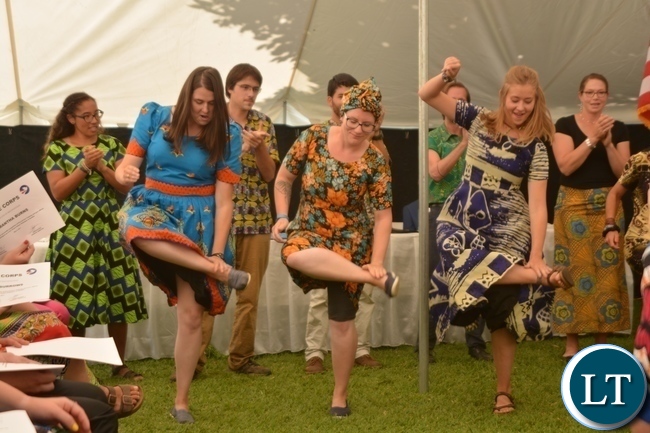 Peace Corp Volunteers performing a Nyanja song during the Peace Corps Swearing in Ceremony for Environment and Aqua-Culture Volunteers in Lusaka