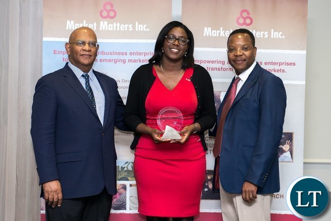 2017 African Agribusiness Entrepreneur of the Year Monica Musonda displays poses with her award