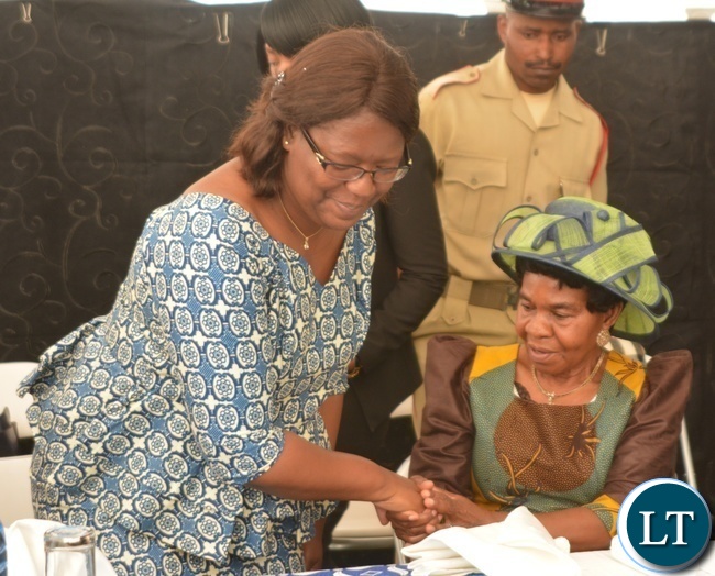 Minister in the Office of the Vice President Sylvia Chalikosa(l) congratulates Her Royal Highness Senior Chieftainess Nkomeshya Mukamambo II after giving her keynote speech at the Peace Corps Swearing in Ceremony for Environment and Aqua-Culture Volunteers in Lusaka