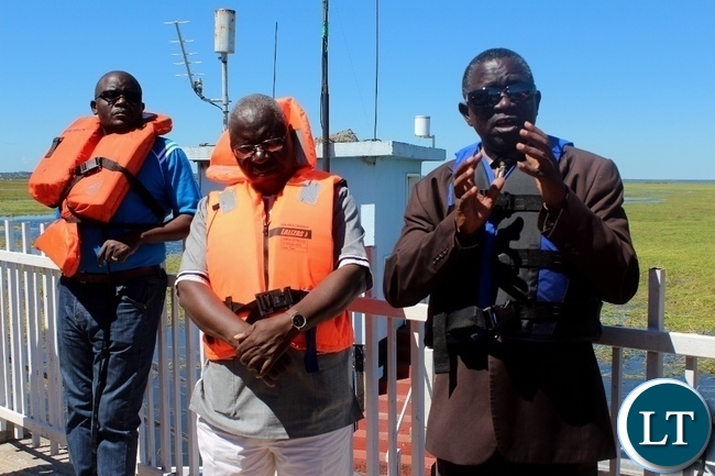 Western Province Permanent Secretary Mwangala Liomba (r) expressing a point as Zimbabwean Energy Permanent Secretary Patson Mbiri (c) listens during the tour of Matongo Platform, a Hydrometric Station on the Barotse Flood Plain in Mongu