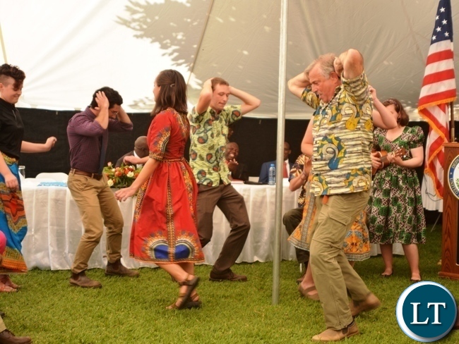 Peace Corp Volunteers performing a Nyanja song during the Peace Corps Swearing in Ceremony for Environment and Aqua-Culture Volunteers in Lusaka