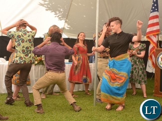Peace Corp Volunteers performing a Nyanja song during the Peace Corps Swearing in Ceremony for Environment and Aqua-Culture Volunteers in Lusaka