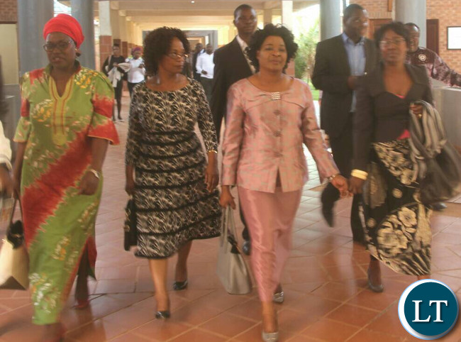 Hichilema's wife Mutinta (in peach) leaving magistrate court after judgement date was set in the insulting language case.