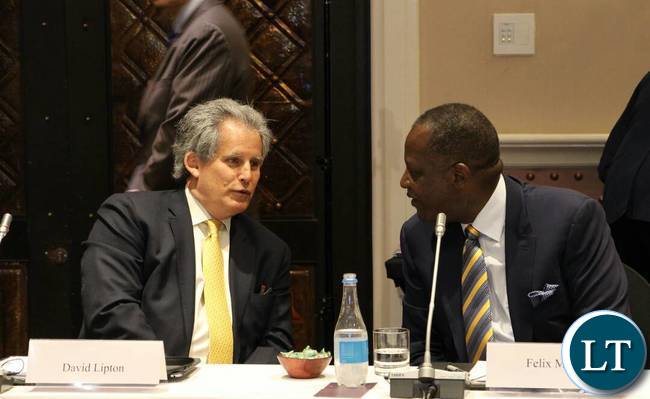 IMF First Deputy Managing Director David Lipton confers with Finance Minister Felix Mutati in Livingstone.