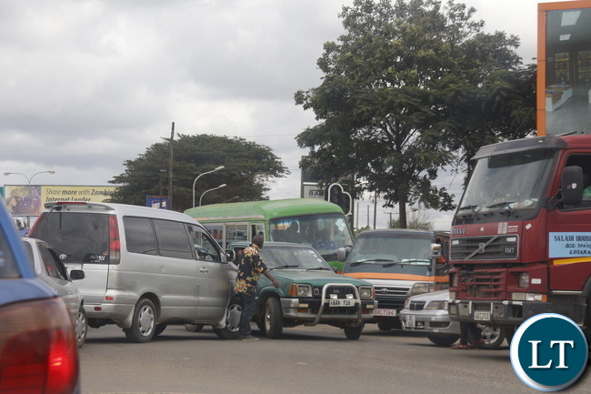 Lusaka Traffic Jam at the Kafue Junction: A motorist trying to control the traffic at Kamwala Kafue road junction around midday. Picture by Jean Mandela