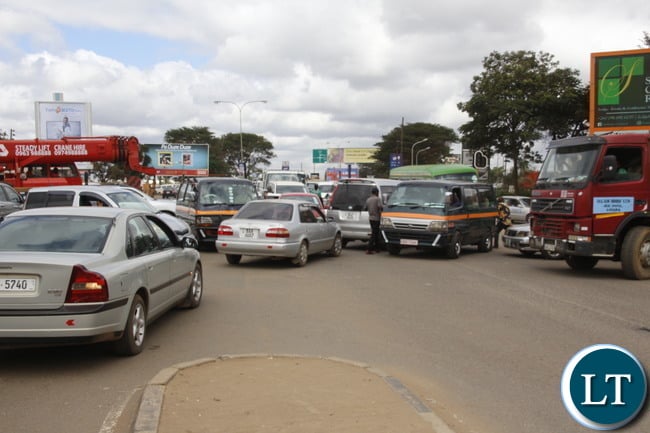 Lusaka Traffic Jam at the Kafue Junction: A motorist trying to control the traffic at Kamwala Kafue road junction around midday. Picture by Jean Mandela Lusaka Traffic Jam at the Kafue Junction: A motorist trying to control the traffic at Kamwala Kafue road junction around midday. Picture by Jean Mandela