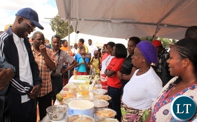 Copperbelt Province Permanent Secretary, Elias Kamanga, admires some of the healthy foods that were displayed by the Ministry of Health and the Ministry of Agricultrure during the launch of the National Health Week at Wusakile Ground in Kitwe