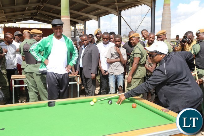 First Lady Esther Lungu playing pool while President Edgar Lungu looks on during the official launch of the 2017 National Health Week at the Olympic Youth Development Centre