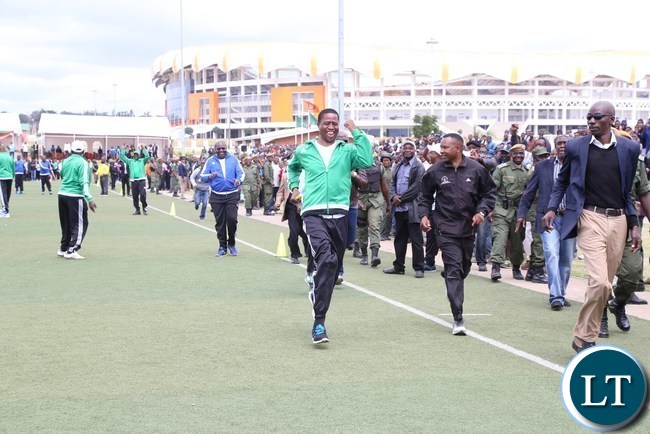 President Edgar Lungu takes part in the 100metres race during the official launch of the 2017 National Health Week at the Olympic Youth Development Centre