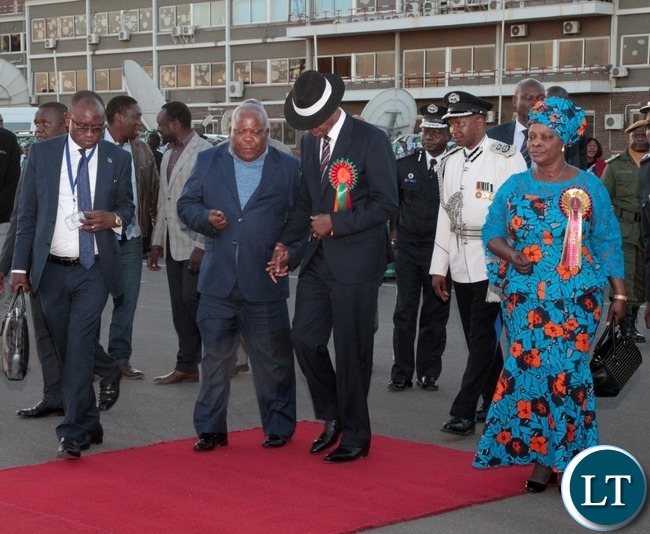 Presidential Affairs Minister Freedom Sikazwe(second left) confers with President Edgar Lungu(second right),First Lady Esther Lungu(right) and Presidential Press Aid Amos Chanda(left) at Kenneth Kaunda International Airport as he arrived from Ndola.Picture by Ennie Kishiki/Zanis. Presidential Affairs Minister Freedom Sikazwe(second left) confers with President Edgar Lungu(second right),First Lady Esther Lungu(right) and Presidential Press Aid Amos Chanda(left) at Kenneth Kaunda International Airport as he arrived from Ndola.Picture by Ennie Kishiki/Zanis.