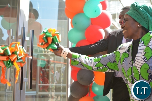 Vice President Inonge Wina cuts the ribbon during the official opening of the thirty four Million kwacha National Institute of Public Administration(NIPA) Information and Conference Centre in Lusaka