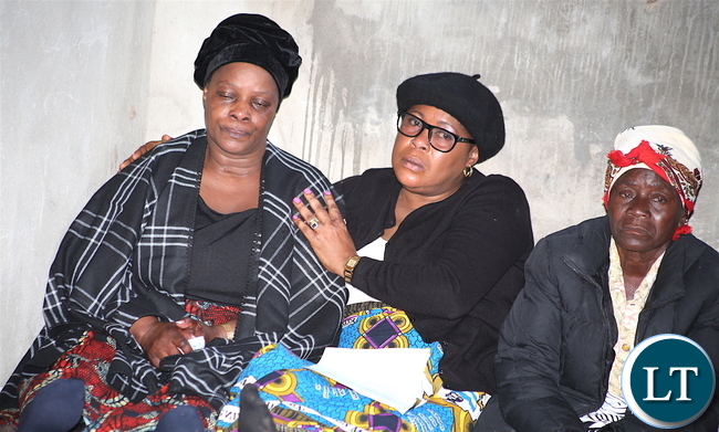 First Lady Esther Lungu pays her last respects to her late brother James Phiri during burial in Chongwe District on Friday, June 23,2017 –Picture by THOMAS NSAMA