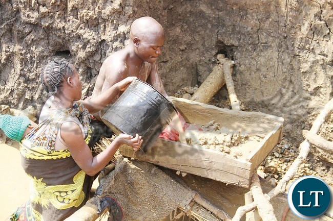 A COUPLE panning for gold at Kadya Alendo in Vubwi district near the Mozambique and Malawi border. - Picture by MACKSON WASAMUNU.