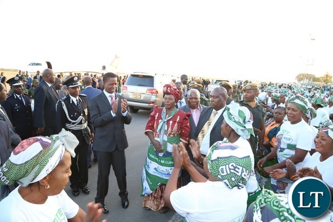 PF chair welcomes President Edgar Lungu who is flanked by Lusaka Province Chairlady Margaret Mumba shortly after his arrival from Lesotho at Kenneth Kaunda International Airport