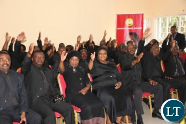 UPND MPs flashing the party symbol during a news briefing