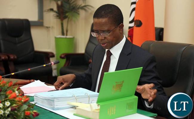 President Edgar Lungu reads the Constitution of Zambia while Chairing a Special cabinet Meeting at State house in Lusaka.