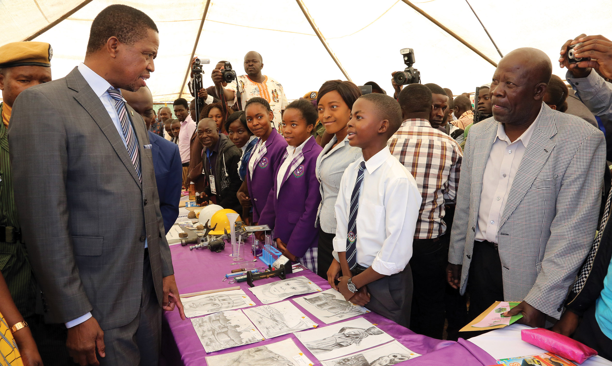 PRESIDENT Lungu talks to 13-year-old Cosmas Mulenga, an art student of Fordina Pandeni Secondary School, at the on-going Luapula Expo in Mansa yesterday. PICTURE: EDDIE MWANALEZA/STATE HOUSE