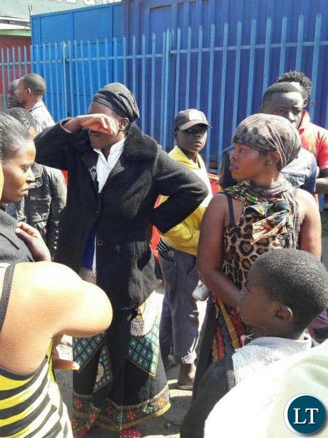 A woman crying after losing her merchandise in the fire