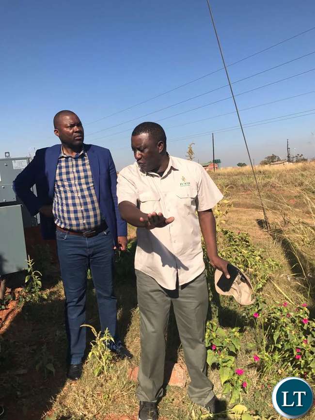 ZESCO Spokesman Henry Kapata explaining the extent of the damage to ZESCO lines to Mr Lusambo