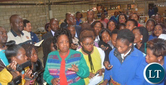 Minister of Labour Joyce Nonde talks to Eve’s Hair Production workers during the inspection of the Eve ’S factory in Lusaka yesterday, Picture by Josephine Nsululu/Zanis.