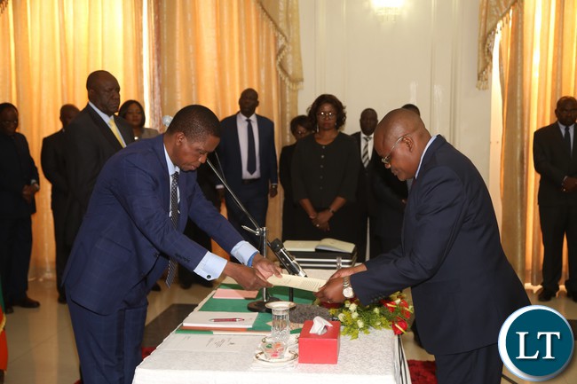President Edgar Lungu receive the letter of Oath from Dr. Kennedy Malama during the swearing in Ceremony at State House