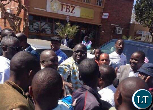 Mr Kambwili is mobbed by a cheering crowd in Monze town centre