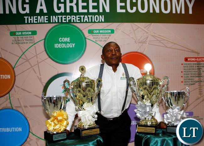 FILE: ZESCO Senior Corporate Affairs Patrick Mwila displaying awards won by the power utility.