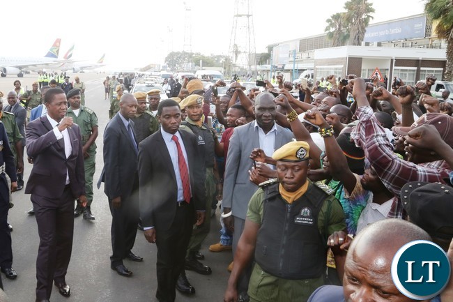 President Edgar Lungu wave the party symbol to the PF members shortly after his arrival from United Nations (USA) Annual General Assembly Meeting at Kenneth Kaunda International Airport