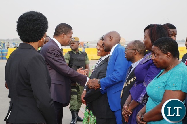 President Edgar Lungu speaking to Justice Minister Given Lubinda and Lusaka Province Minister Japhen Mwakalombe on his arrival from United Nations (USA) Annual General Meeting Assembly at Kenneth Kaunda International Airport