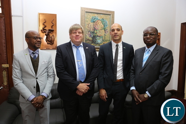 Caption: Presidential spokesman Amos Chanda flanked by Zambia’s Charge d’ Affaires in Sweden Anthony Mukwita, Bombardier head of rail Christian Bengtsson and head of bids Johan Oldhoff at State House. Picture by Salim Henry. State House.