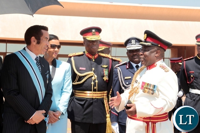 PRESIDENT Seretse Khama Ian Khama confers with Col .Chewe after seeing off President Edgar Lungu at Sereste Khama International Airport