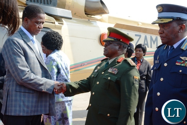 President Edgar Lungu greeting Service Chiefs at Kenneth Kaunda International Airport before departing for Angola.
