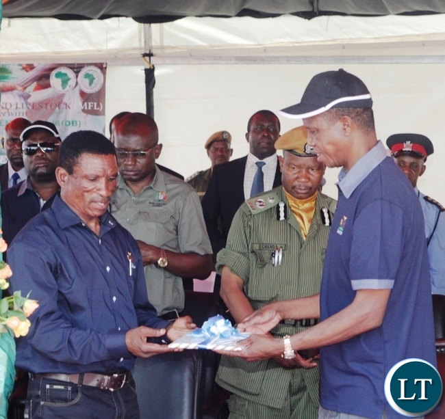 President Edgar Lungu receives a Project Document from fisheries and Livestock Minister Micheal Katambo during the launch of Zambia Aquaculture Enterprise Development Project in Lilayi