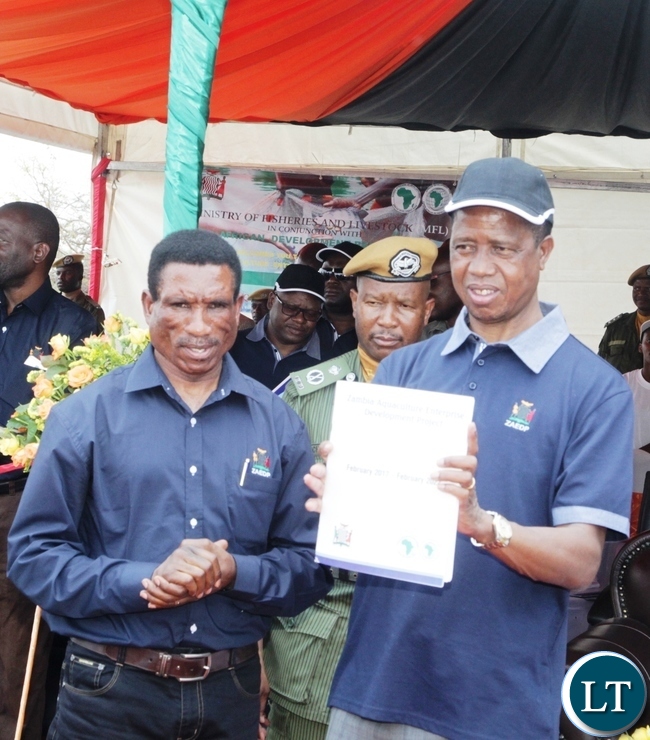 -President Edgar Lungu displays a Project Document during the launch of Zambia Aquaculture Enterprise Development Project in Lilayi