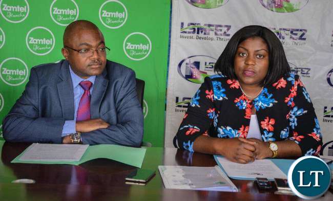 Lusaka South MFEZ Acting CEO Mukela Lubasi speaking during the signing ceremony as Zamtel Chief Fixed and Enterprise Sales Officer Mr Reuben Kamanga looks on