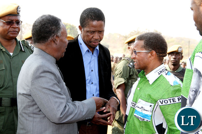 President Michael Sata with Home affairs minister Edgar Lungu (c) and PF Mkaika constituency parliamentary candidate David Phiri after a rally to drum up support for Phiri in Katete on Sept 2,2013 -Picture by THOMAS NSAMA
