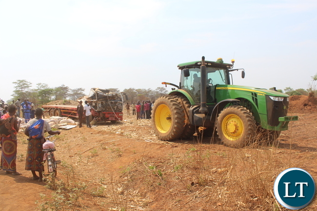 A Zambeef tractor pulls the cabin of a truck in a bid to set free the deceased driver who was trapped in the motor vehicle for over 5 hours following an accident along the Chowa Lukanga Road in Mpongwe this morning. Picture by Noah Kangali. (ZANIS)