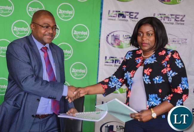 Zamtel Chief Fixed and Enterprise Sales Officer Mr Reuben Kamanga and Lusaka South MFEZ Acting CEO Mukela Lubasi at the contract signing ceremony Zamtel Chief Fixed and Enterprise Sales Officer Mr Reuben Kamanga and Lusaka South MFEZ Acting CEO Mukela Lubasi at the contract signing ceremony