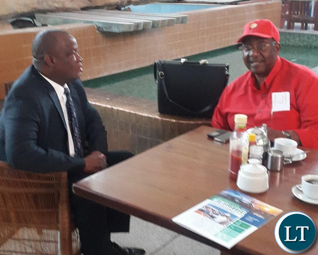 Mr Bwalya pictured with his lawyer Jack Mwiimbu at KKIA earlier today before flying off to Ndola for the court appearance.