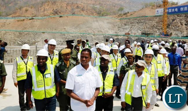 President Edgar Chagwa Lungu (centre) flanked by ZESCO Managing Director Victor Mundende (right) and Kafue Gorge Lower Hydro Power Project Director Wesley Lwiindi (left) during the River Diversion Ceremony at Kafue Gorge in Chikankanta District of Southern Province on Wednesday,October 4,2017. PICTURE BY SALIM HENRY/STATE HOUSE ©2017