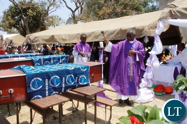Vicar General Fr. Rodgers Fikwamo during mass for the burial of the 17 accident victims held at Mambwe Mission in Senga district today. The 17 died when the Isuzu truck Reg No ACK 5871 which was carrying over 60 members of the Catholic church along the Mbala-Mpulungu road on saturday morning overturned after losing brakes. Several other people are still admitted to Mbala and Mpulungu hospitals with head inquires.-Picture by Mary Bwembya (ZANIS)