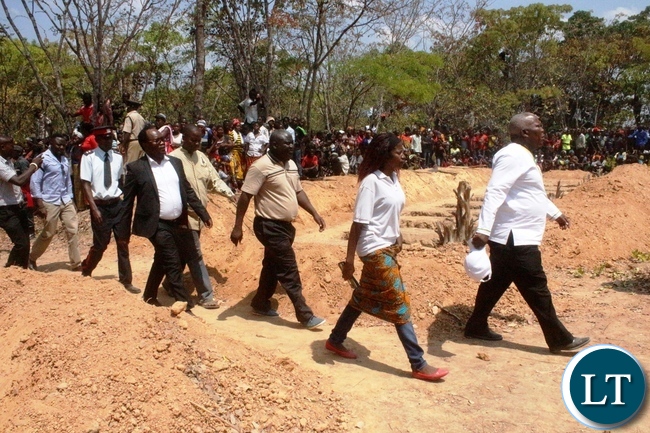 Presidential Affairs Minister Freedom Sikazwe leads his counterparts and MPs from Northern for the burial of the 17 accident victims held at Mambwe Mission in Senga district today. The 17 died when the Isuzu truck Reg No ACK 5871 which was carrying over 60 members of the catholic church overturned after losing brakes. Several other people are still admitted to Mbala and Mpulungu hospitals with head inquires.-Picture by Mary Bwembya (ZANIS)