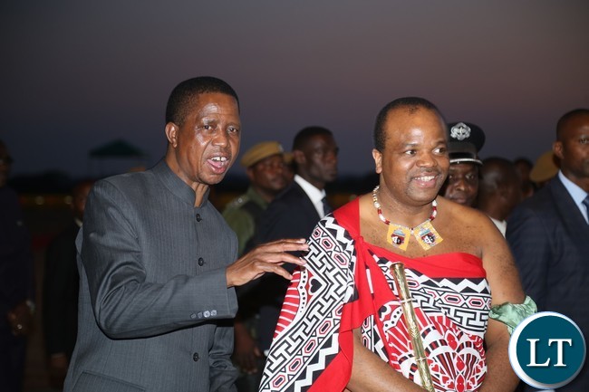 President Edgar Lungu having a light moment with King Muswati III shorty on his arrival at Kenneth Kaunda International Airport yesterday 04-11-2017. Picture by ROYD SIBAJENE/ZANIS President Edgar Lungu having a light moment with King Muswati III shorty on his arrival at Kenneth Kaunda International Airport yesterday 04-11-2017. Picture by ROYD SIBAJENE/ZANIS