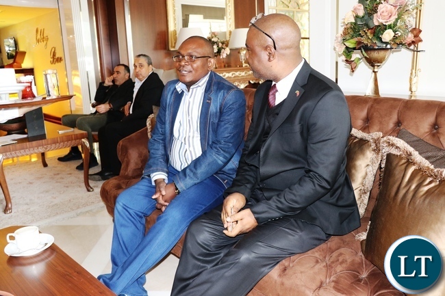 First Secretary Tourism at the Embassy of the Republic of Zambia in Turkey, Sydney Zulu (Right), conferring with Ministry of General Education Director for Planning and Information Louis Mwansa at Latanya Hotel in Ankara